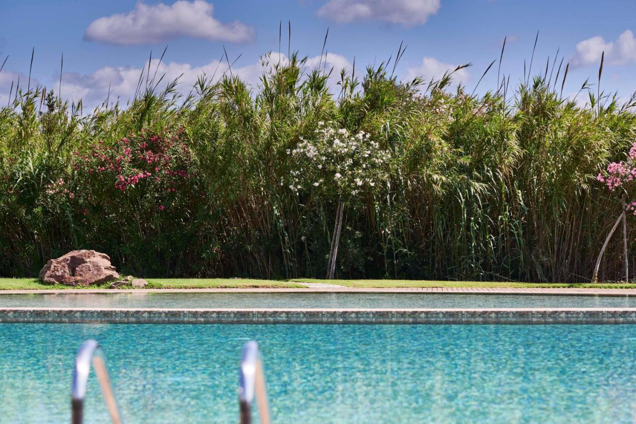 Baia Di Chia Resort Sardinia, Curio Collection By Hilton Екстер'єр фото