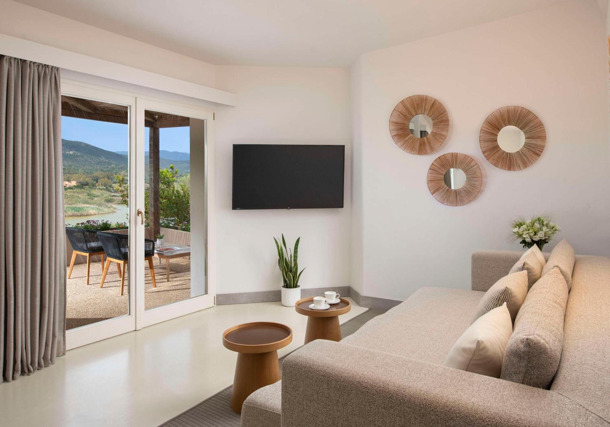 Baia Di Chia Resort Sardinia, Curio Collection By Hilton Екстер'єр фото
